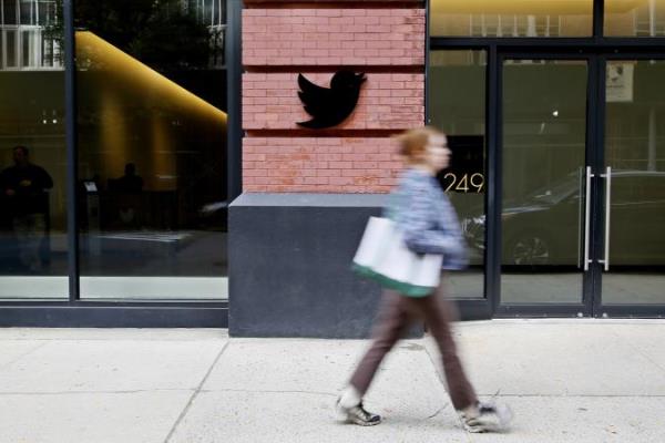 NEW YORK, NEW YORK - OCTOBER 28: A woman walks past the Twitter Headquarters on October 28, 2022 in New York City. A day after Elon Musk completed Twitter takeover the U.S. Securities and Exchange Commission notified its intention of delisted the company from the New York Stock Exchange according to a new filing with the U.S. Securities and Exchange Commission. (Photo by Leo<em></em>nardo Munoz/VIEWpress)